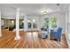 Comfortable living room has hardwood floors, large windows, and access to the outdoor patio at 3265 Belmont Glen Se Dr, Marietta, GA 30067