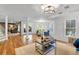 Spacious living room with hardwood floors, natural light and access to an adjacent room at 3265 Belmont Glen Se Dr, Marietta, GA 30067