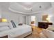 Inviting main bedroom showcasing a trey ceiling, hardwood floors, and a view to the ensuite at 3265 Belmont Glen Se Dr, Marietta, GA 30067
