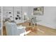 Cozy home office with custom built-ins, a clear desk, and comfortable seating area at 3265 Belmont Glen Se Dr, Marietta, GA 30067