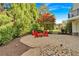 Charming stone patio features ample seating, mature trees, and lush landscaping at 3265 Belmont Glen Se Dr, Marietta, GA 30067