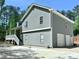 Charming two-story home featuring a two-car garage, covered porch, and newly installed siding and roof at 4872 Lewis Rd, Powder Springs, GA 30127