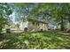 Backyard with fencing, grass, and mature shade trees at 176 Nancy Se Dr, Marietta, GA 30067