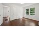 This bedroom features hardwood floors and a large window at 176 Nancy Se Dr, Marietta, GA 30067