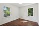 Bright bedroom with hardwood floors and natural light from two large windows at 176 Nancy Se Dr, Marietta, GA 30067