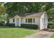 Front yard of a traditional home with a well-kept lawn and a charming facade at 176 Nancy Se Dr, Marietta, GA 30067