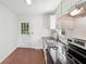 Bright kitchen features white cabinets, granite countertops, and a garden door at 176 Nancy Se Dr, Marietta, GA 30067