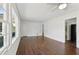 Spacious living area featuring hardwood floors, large windows, and multiple entryways at 176 Nancy Se Dr, Marietta, GA 30067
