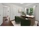 Well-lit home office features hardwood floors, a neutral rug, and stylish furnishings at 176 Nancy Se Dr, Marietta, GA 30067