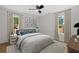 Well-lit bedroom featuring neutral decor, carpet, and large windows with custom drapes at 1835 Hawkins Se St, Smyrna, GA 30080