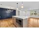 Open concept kitchen and dining area with hardwood floors and stainless steel appliances at 1835 Hawkins Se St, Smyrna, GA 30080