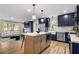 Modern kitchen featuring an island, stainless steel appliances, and hardwood floors at 1835 Hawkins Se St, Smyrna, GA 30080