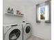 Bright laundry room featuring a front load washer and dryer at 1835 Hawkins Se St, Smyrna, GA 30080