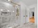 Modern bathroom featuring a glass shower, a rainfall shower head, subway tile surround, and gold hardware at 1835 Hawkins Se St, Smyrna, GA 30080
