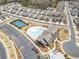 Aerial view showcasing the community pool, clubhouse, pickleball courts and surrounding homes at 221 Hickory Bluffs Pkwy, Canton, GA 30114