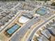 Aerial view showcasing the community pool, clubhouse, tennis courts and surrounding homes at 221 Hickory Bluffs Pkwy, Canton, GA 30114