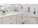 Bright bathroom featuring a white vanity with modern fixtures, a large mirror, and a glass-enclosed shower at 221 Hickory Bluffs Pkwy, Canton, GA 30114