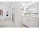 Well-lit bathroom showcasing a spacious layout, a glass shower, and a vanity with a large mirror at 221 Hickory Bluffs Pkwy, Canton, GA 30114