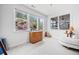 Bright bedroom with large windows offering views of the hillside, a cozy seating area, and carpet flooring at 221 Hickory Bluffs Pkwy, Canton, GA 30114