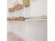 Organized closet with wire shelves, baskets, and folded towels, maximizing storage space at 221 Hickory Bluffs Pkwy, Canton, GA 30114