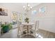 Cozy dining area with natural light, a modern chandelier, and access to the outdoor space at 221 Hickory Bluffs Pkwy, Canton, GA 30114