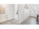 Entryway into home with views of a bathroom and living spaces showing off the hardwood flooring at 221 Hickory Bluffs Pkwy, Canton, GA 30114