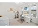 Bright home office with a large window, desk, and organized shelving, creating a workspace at 221 Hickory Bluffs Pkwy, Canton, GA 30114