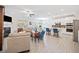 Bright open concept living room featuring a fireplace, hardwood floors, and a modern kitchen with an island at 221 Hickory Bluffs Pkwy, Canton, GA 30114