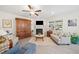 Cozy living room with fireplace, hardwood floors, and bright natural light at 221 Hickory Bluffs Pkwy, Canton, GA 30114