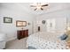 Comfortable main bedroom with a tray ceiling, carpet, and a doorway leading to a bathroom at 221 Hickory Bluffs Pkwy, Canton, GA 30114