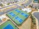 Aerial view of the community's pickleball courts with parking and landscaping surrounding the courts at 221 Hickory Bluffs Pkwy, Canton, GA 30114