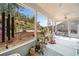 Relaxing sunroom with expansive views of the terraced backyard garden at 221 Hickory Bluffs Pkwy, Canton, GA 30114