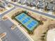 Aerial view of the community's well-maintained tennis courts surrounded by landscaping and parking at 221 Hickory Bluffs Pkwy, Canton, GA 30114