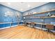 Study or work stations with hardwood floors and blue patterned wallpaper at 221 Hickory Bluffs Pkwy, Canton, GA 30114