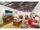 Finished basement featuring a cozy living area, dining space, and functional kitchenette at 2361 Mann Rd, Douglasville, GA 30134