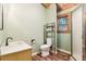 Bathroom featuring a modern toilet, walk-in shower, and vanity with natural light at 2361 Mann Rd, Douglasville, GA 30134