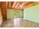 Bedroom with wood paneling, natural light, and a ceiling fan at 2361 Mann Rd, Douglasville, GA 30134