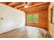 Bright bedroom featuring wood ceiling, updated flooring and large window at 2361 Mann Rd, Douglasville, GA 30134