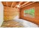 Bedroom featuring wood paneling, and natural light from a double window at 2361 Mann Rd, Douglasville, GA 30134
