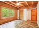 Bedroom featuring wood ceiling, updated flooring, large windows and closet at 2361 Mann Rd, Douglasville, GA 30134