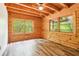 Bright bedroom featuring wood ceiling, updated flooring and large window at 2361 Mann Rd, Douglasville, GA 30134