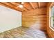 Bright bedroom featuring wood ceiling, updated flooring and wood-paneled wall at 2361 Mann Rd, Douglasville, GA 30134