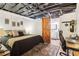 Basement bedroom area with barn door to bathroom, desk, and comfy bed at 2361 Mann Rd, Douglasville, GA 30134