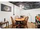 Cozy basement dining area with a round wooden table and seating for four people at 2361 Mann Rd, Douglasville, GA 30134
