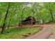 Secluded log home on a tree-lined driveway at 2361 Mann Rd, Douglasville, GA 30134