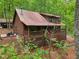 Beautiful log cabin with a large deck, perfect for enjoying nature at 2361 Mann Rd, Douglasville, GA 30134