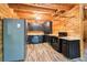 Well-equipped kitchen with dark cabinetry and stainless steel appliances at 2361 Mann Rd, Douglasville, GA 30134