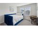 Cozy bedroom featuring a blue daybed, desk, and plush carpeting at 4389 Treadle Sw Rd, Mableton, GA 30126