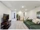 Upstairs bonus room features plush carpeting, a large sofa, and a media center at 4389 Treadle Sw Rd, Mableton, GA 30126