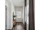 Inviting entryway with hardwood floors, white walls, and a view of the front door at 4389 Treadle Sw Rd, Mableton, GA 30126